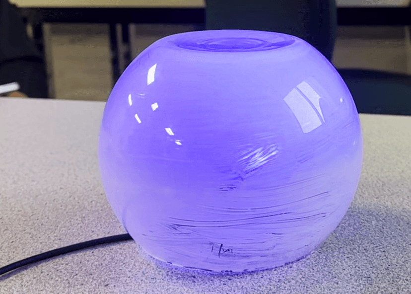 The ProxyBridge orb glowing purple on a conference table